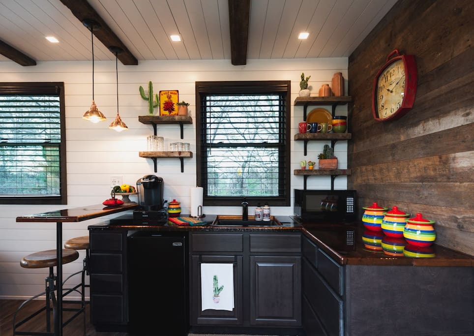 Colorful kitchen with barn wood countertops.