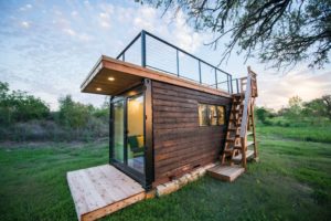 Our 20' container home clad in Shou Sugi Ban siding.