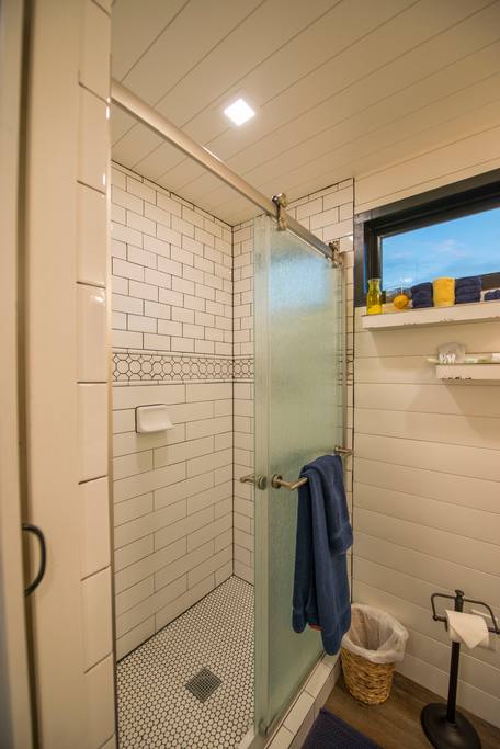 Full size custom-tiled shower.