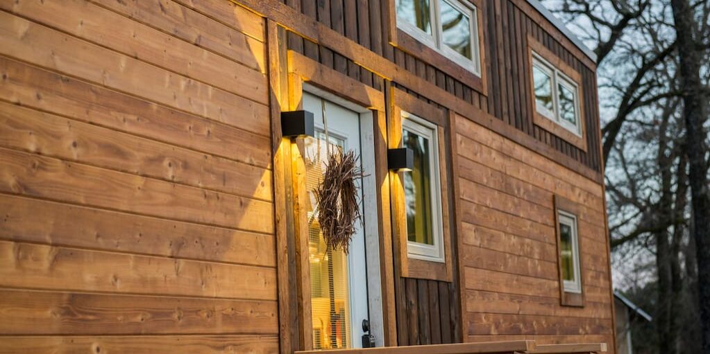 This elegant tiny house is clad in hand-made Shou Sugi Ban cedar siding.